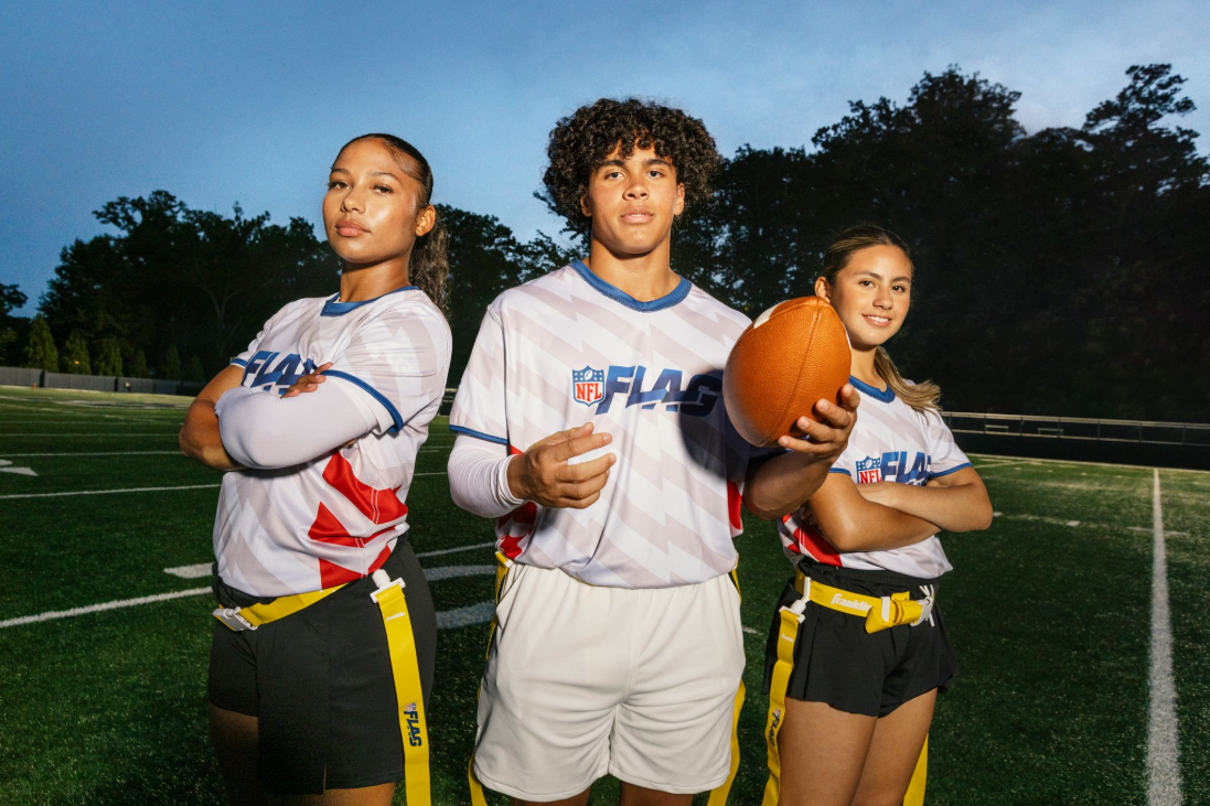 Athletes posing with football